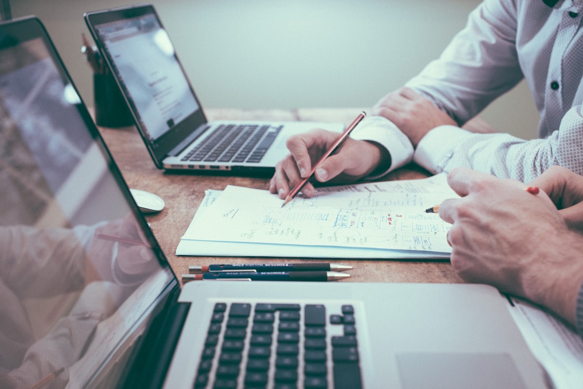 Couple reviewing financial documents together at a desk